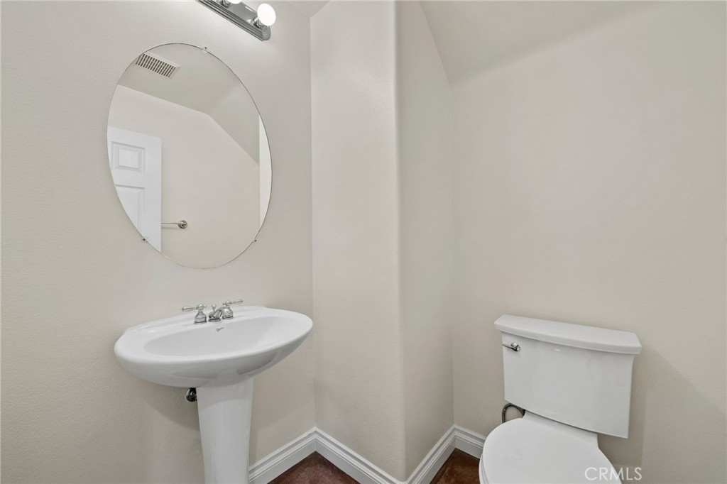 3 Wildflower Place Ladera Ranch, CA 92694 - Photo 17 of 32 a bathroom with a sink toilet and a mirror