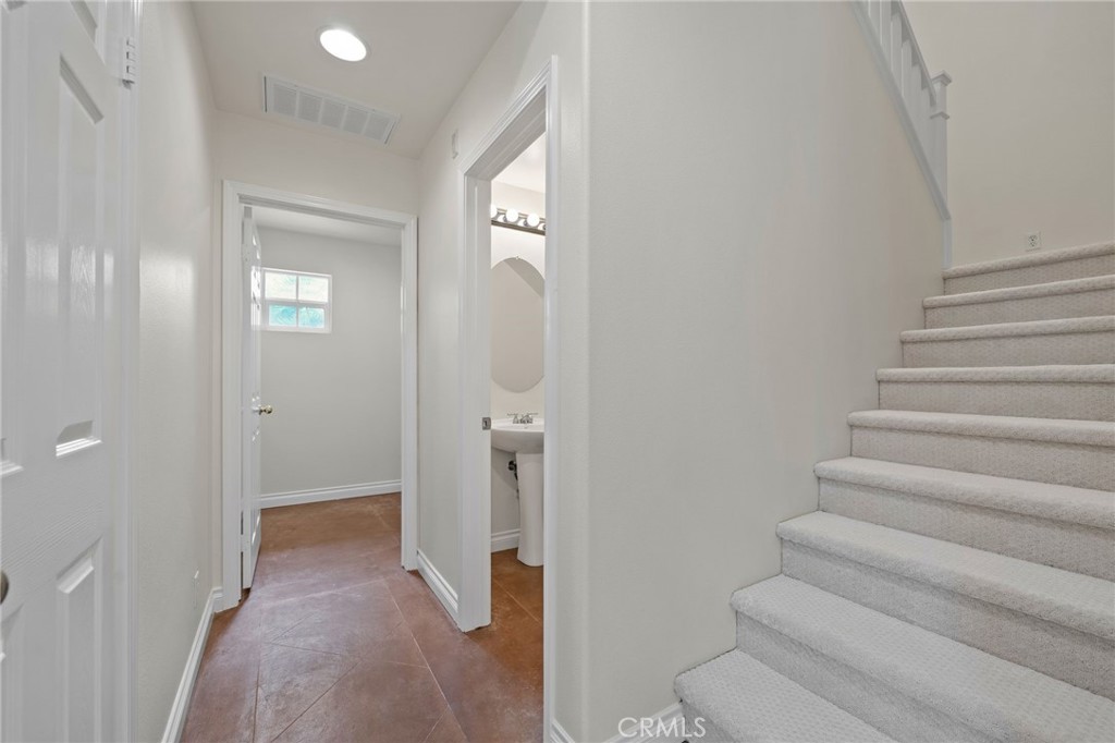 3 Wildflower Place Ladera Ranch, CA 92694 - Photo 18 of 32 a view of a hallway with wooden floor and entryway