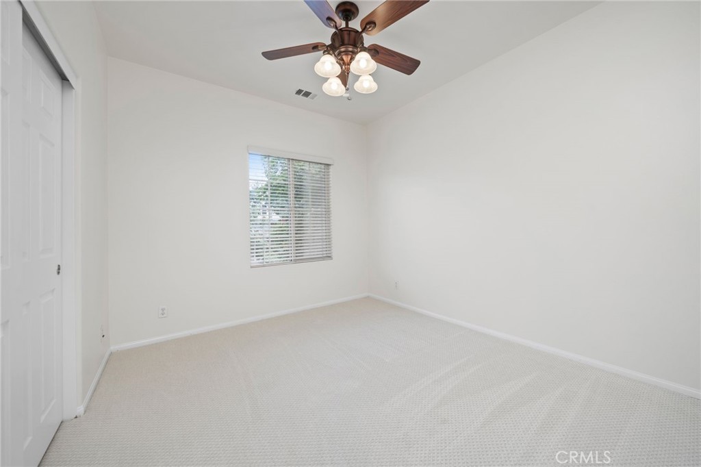 3 Wildflower Place Ladera Ranch, CA 92694 - Photo 20 of 32 an empty room with a window and a fan
