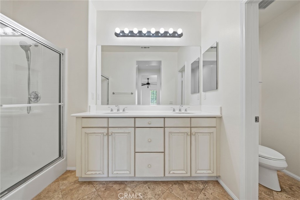 3 Wildflower Place Ladera Ranch, CA 92694 - Photo 27 of 32 a bathroom with a sink and a mirror