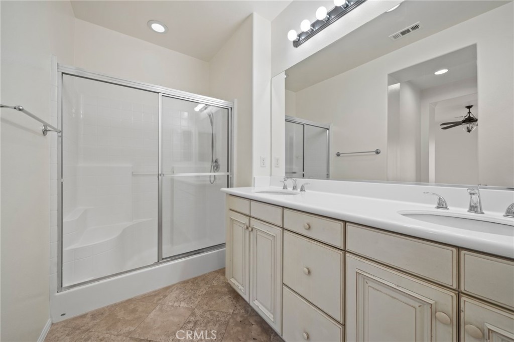 3 Wildflower Place Ladera Ranch, CA 92694 - Photo 29 of 32 a bathroom with a double vanity sink and a mirror