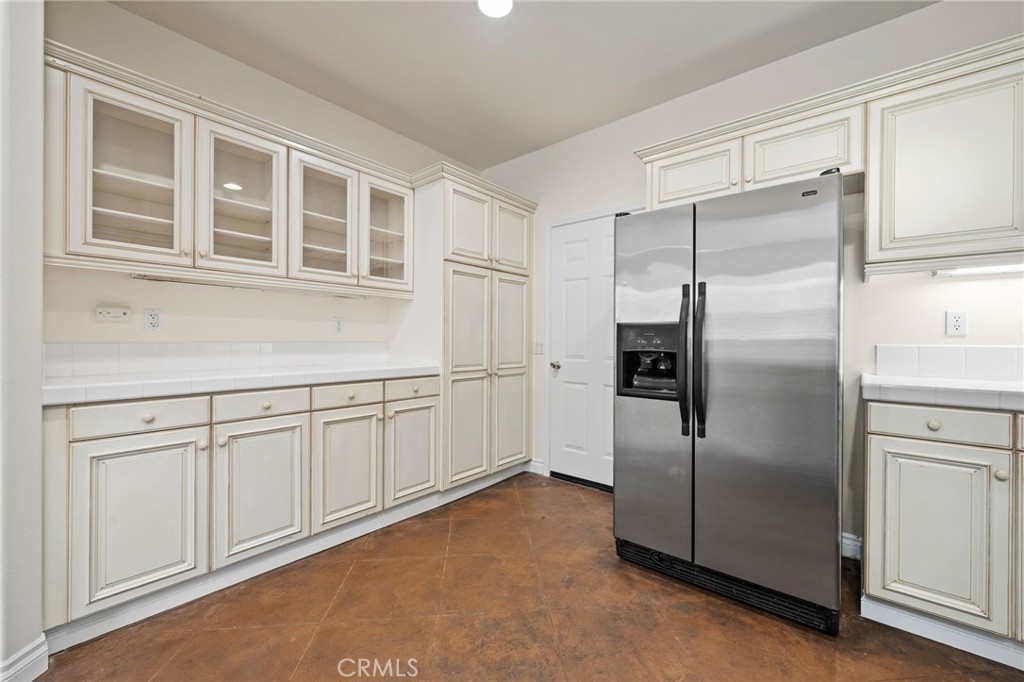 3 Wildflower Place Ladera Ranch, CA 92694 - Photo 5 of 32 a kitchen with stainless steel appliances refrigerator and cabinets