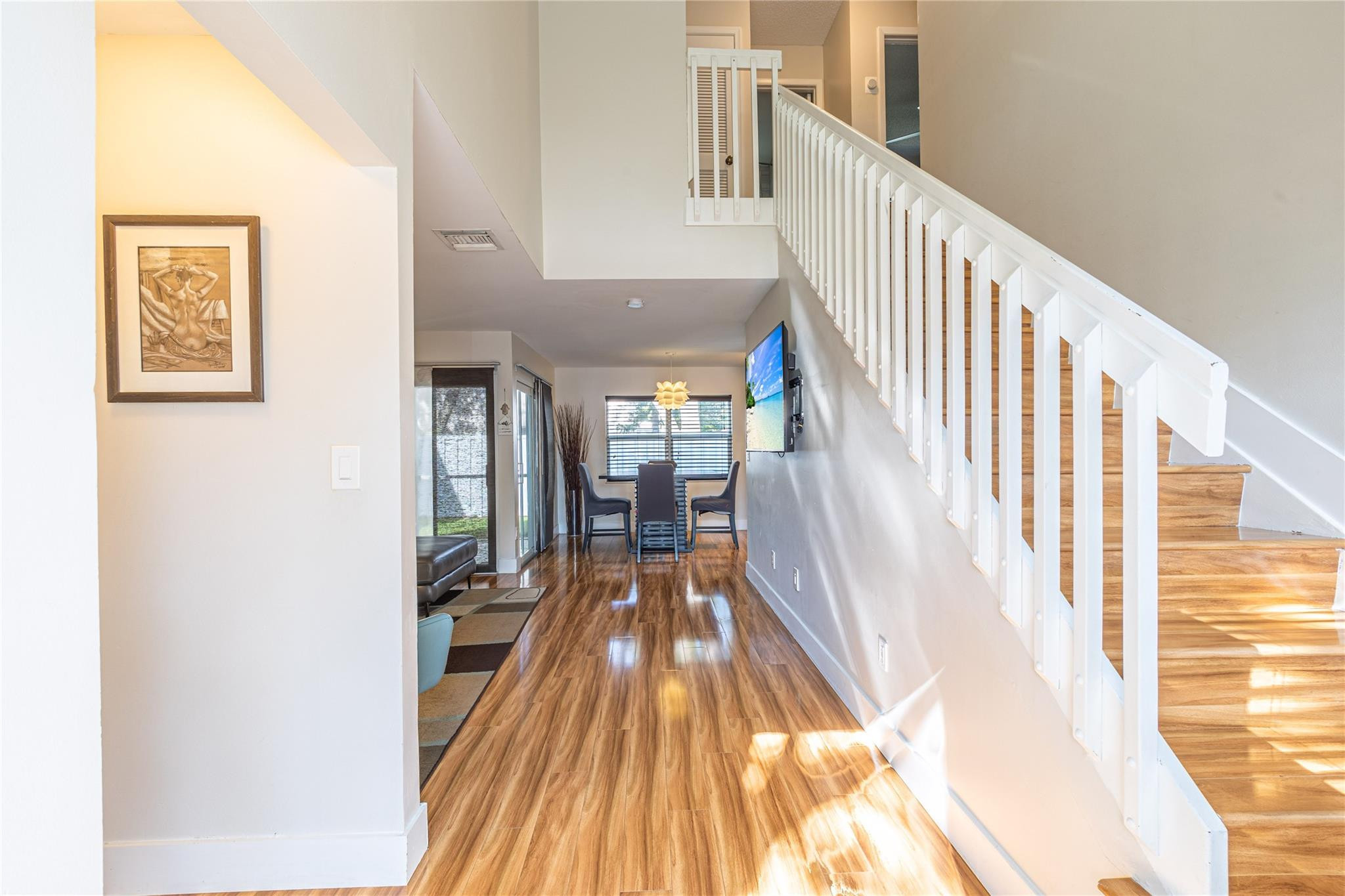 9871 Northwest 2nd Court Plantation, FL 33324 - Photo 14 of 21 a view of a hallway with wooden floor and staircase
