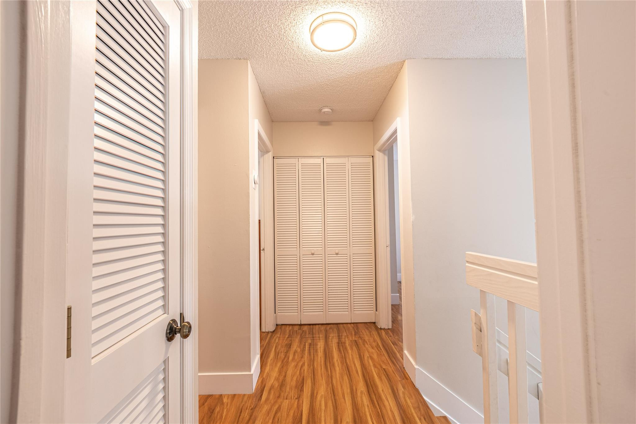 9871 Northwest 2nd Court Plantation, FL 33324 - Photo 17 of 21 a view of a hallway with wooden floor and staircase