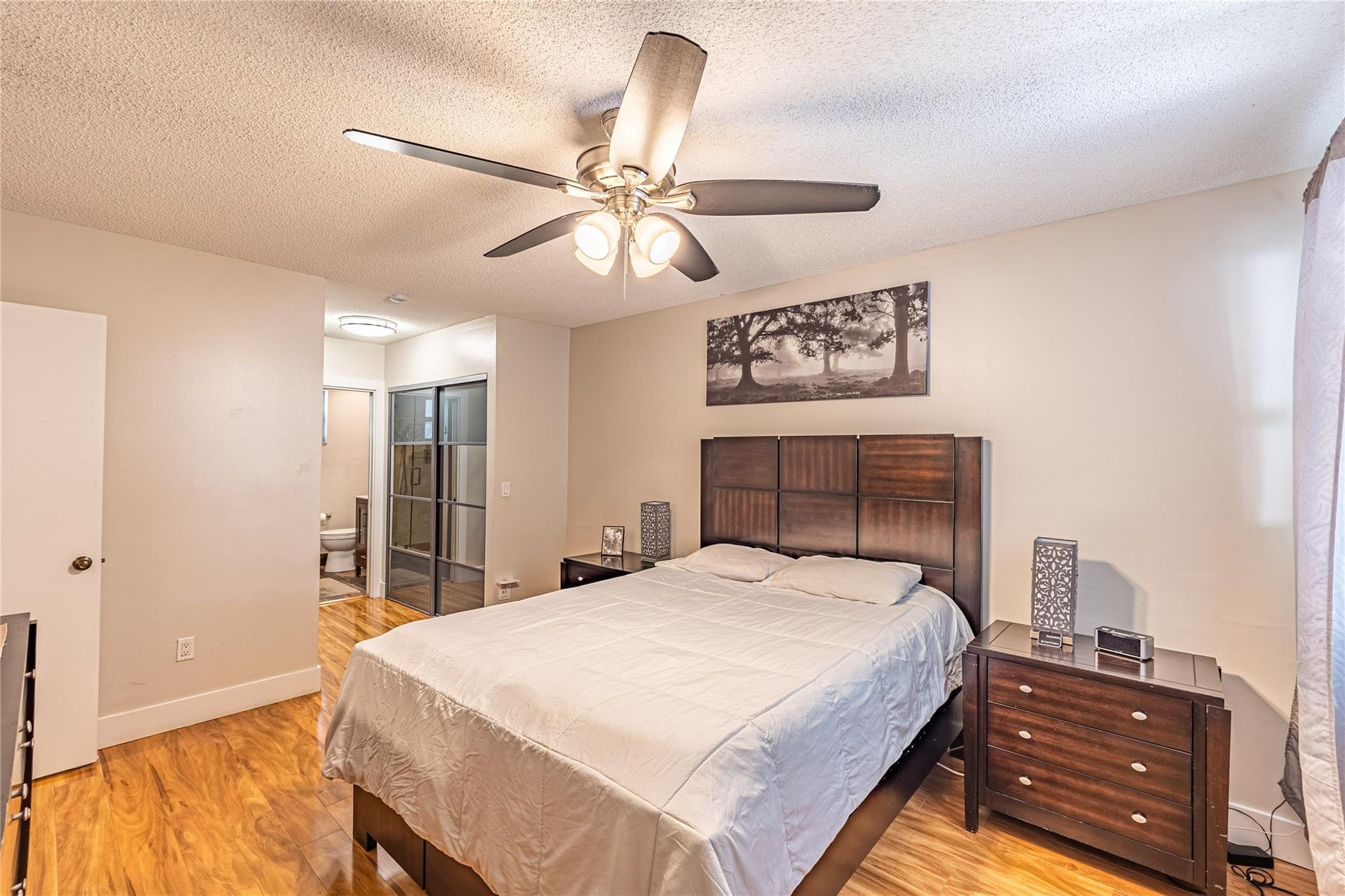9871 Northwest 2nd Court Plantation, FL 33324 - Photo 4 of 21 a bedroom with a bed and a chandelier
