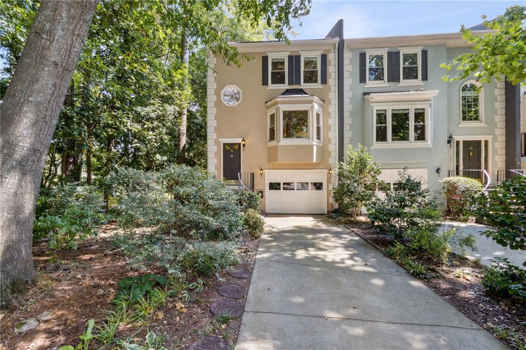 55 Sycamore Station Decatur, GA 30030 - Photo 1 of 1 a front view of a house with garden