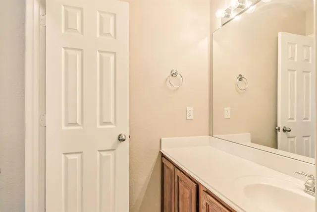 a table and chairs sitting in patio with a yard
