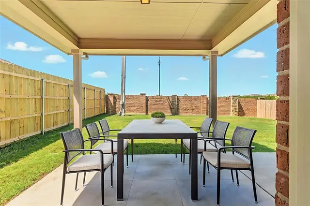 a view of a back yard with a street