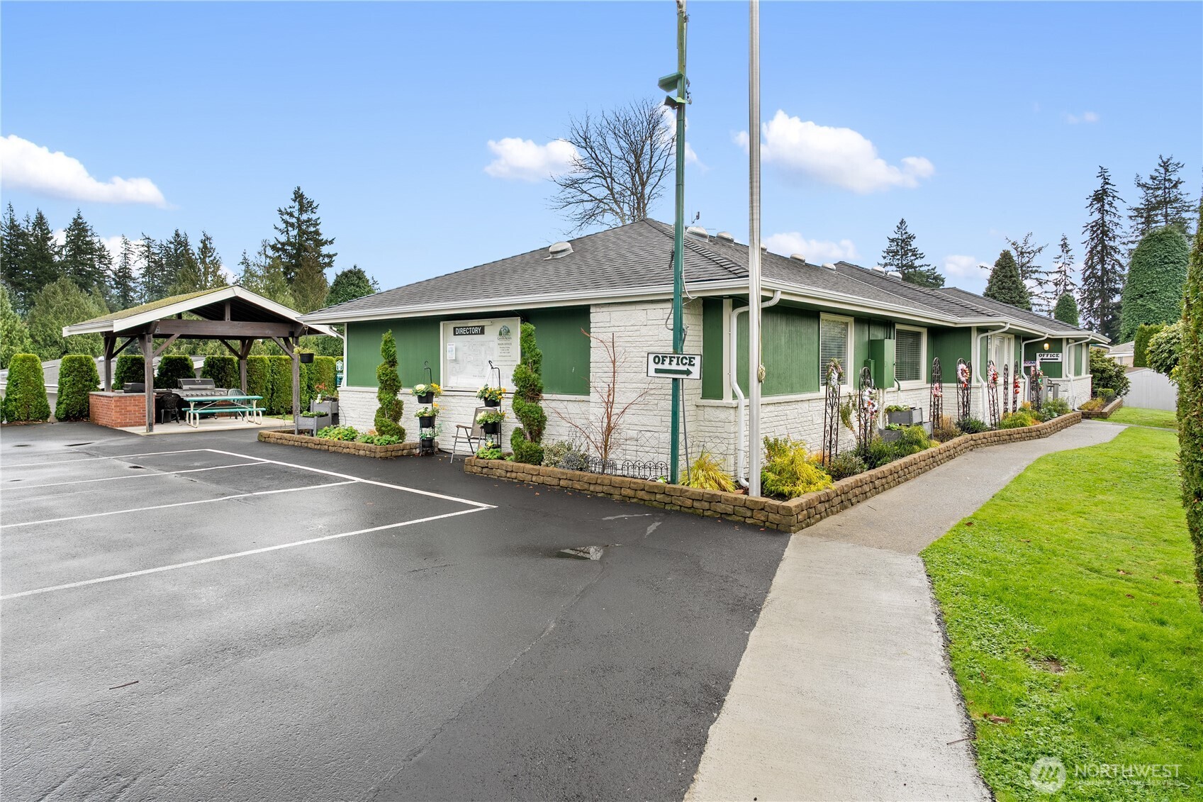 23825 15th Avenue Southeast, Unit 40 Bothell, WA 98021 - Photo 29 of 39 a view of a patio with a table and chairs under an umbrella