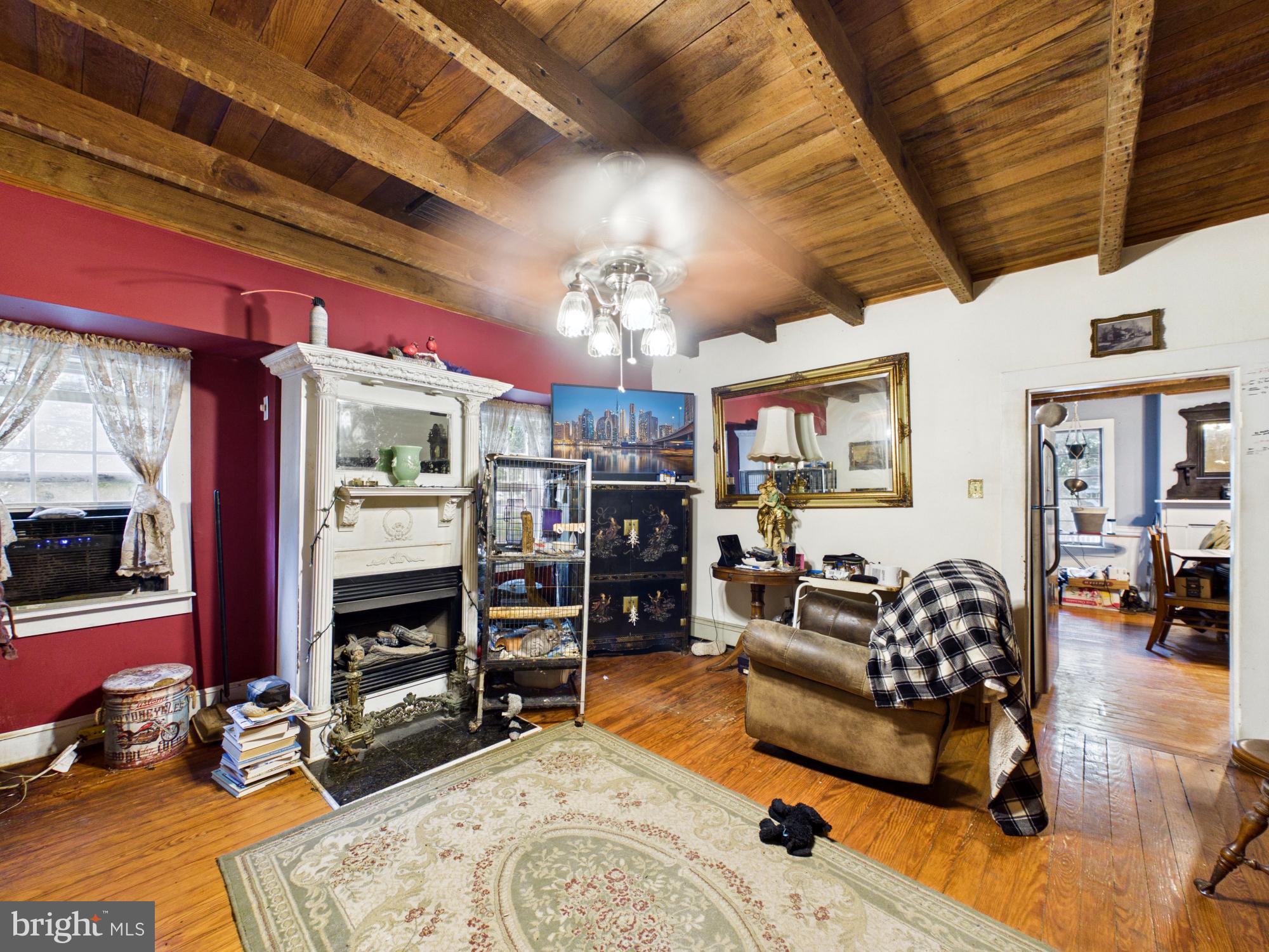 20488 Nanticoke Road Nanticoke, MD 21840 - Photo 12 of 36 Charming living space with rustic beams.