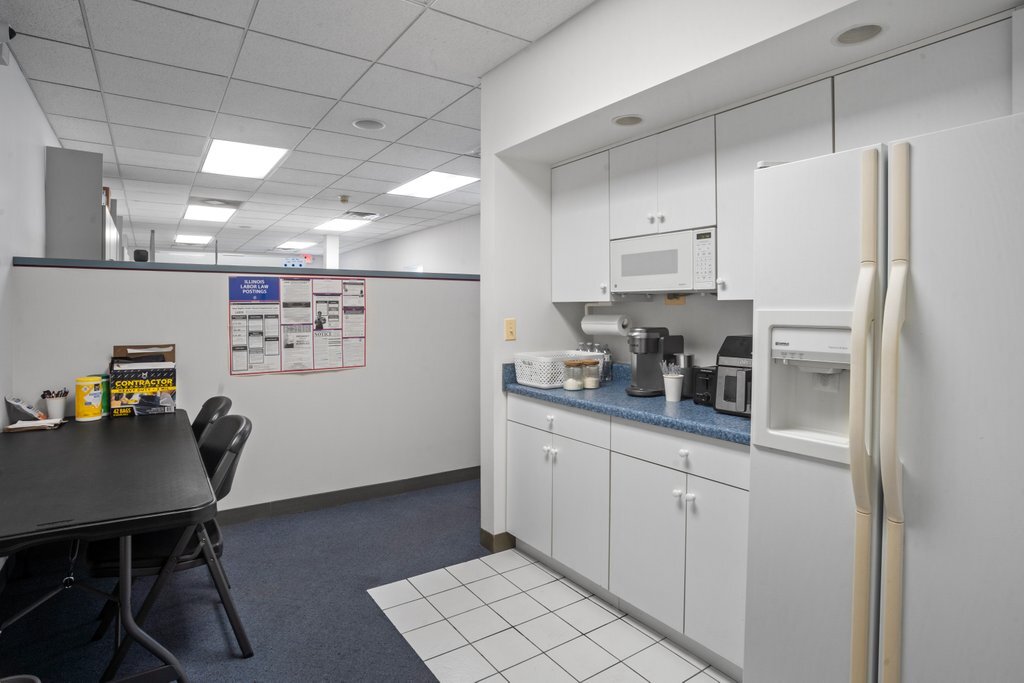4425 Harlem Avenue Berwyn, IL 60402 - Photo 11 of 31 a kitchen with stainless steel appliances a refrigerator and a stove top oven