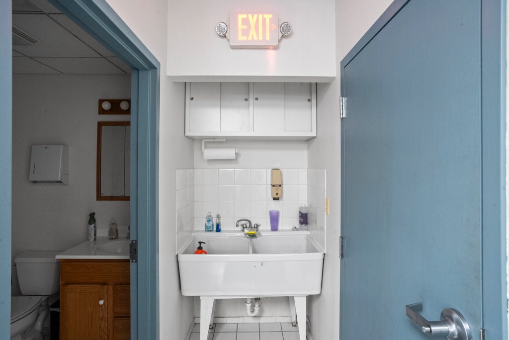 4425 Harlem Avenue Berwyn, IL 60402 - Photo 12 of 31 a bathroom with a sink and a mirror