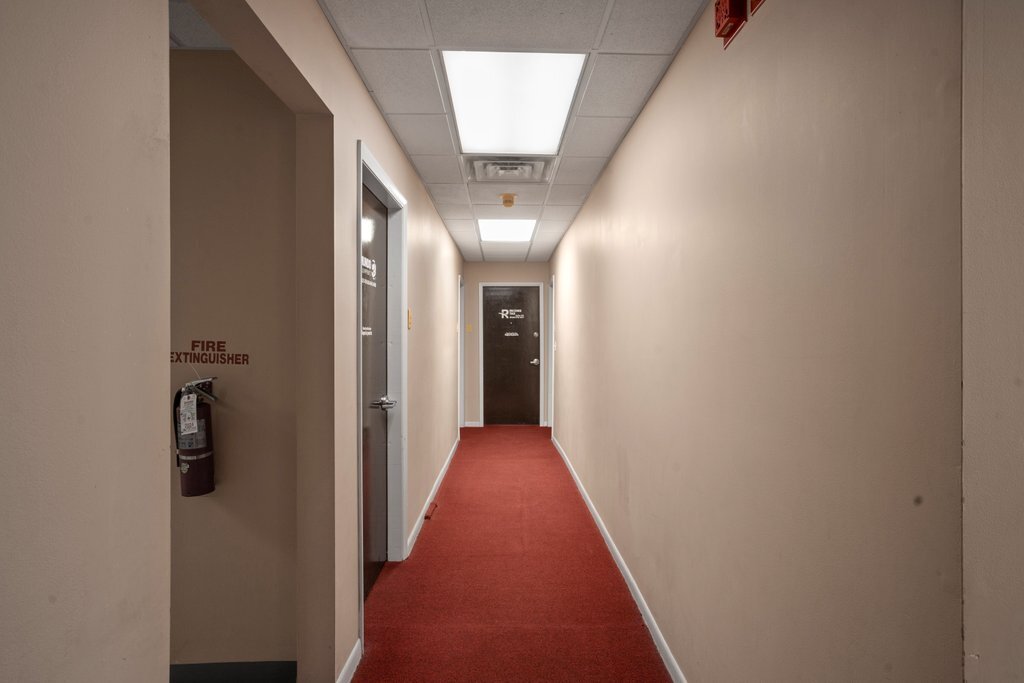 4425 Harlem Avenue Berwyn, IL 60402 - Photo 26 of 31 a view of a hallway with wooden floor and a bathroom