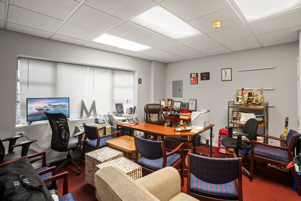 4425 Harlem Avenue Berwyn, IL 60402 - Photo 31 of 31 a room with furniture a rug and a window