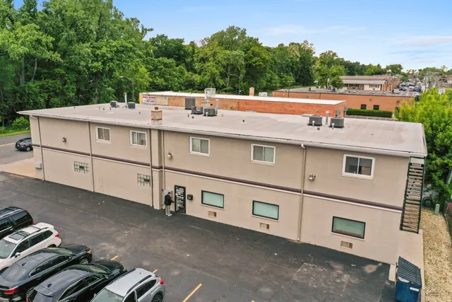 a kitchen with sink stove and cabinets