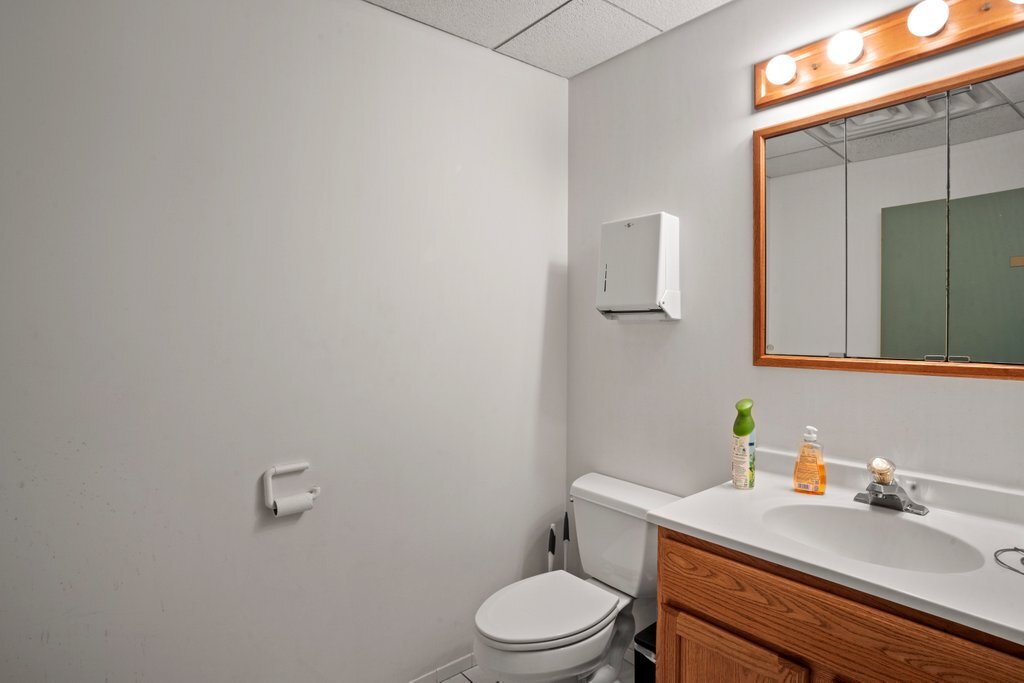 4425 Harlem Avenue Berwyn, IL 60402 - Photo 10 of 31 a bathroom with a granite countertop toilet sink and mirror