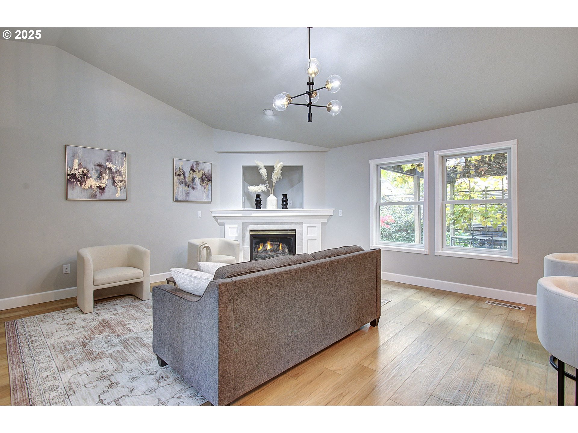 2513 Northwest 147th Street Vancouver, WA 98685 - Photo 12 of 42 a living room with furniture and a fireplace