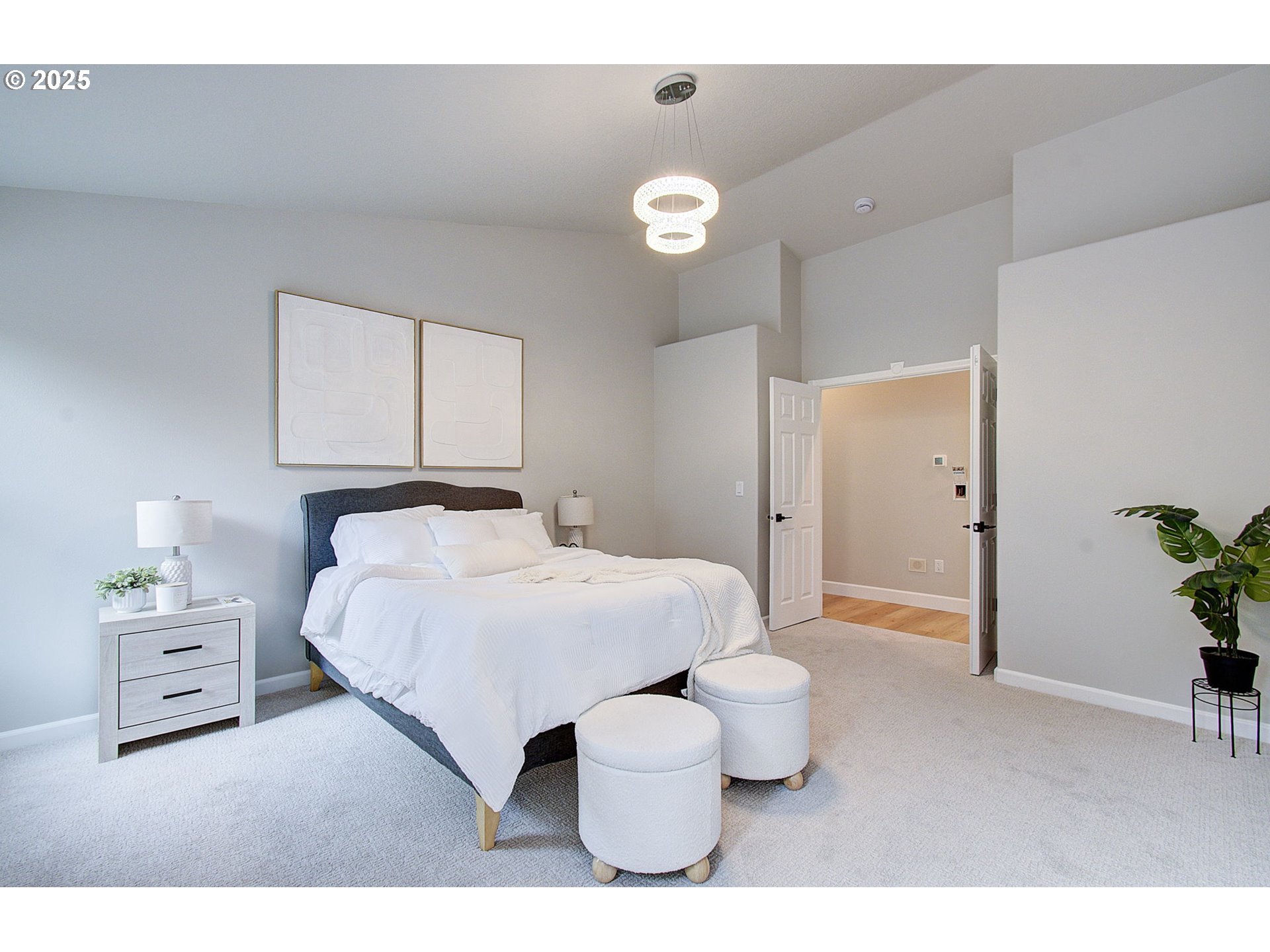 2513 Northwest 147th Street Vancouver, WA 98685 - Photo 21 of 42 a bedroom with a bed and a potted plant