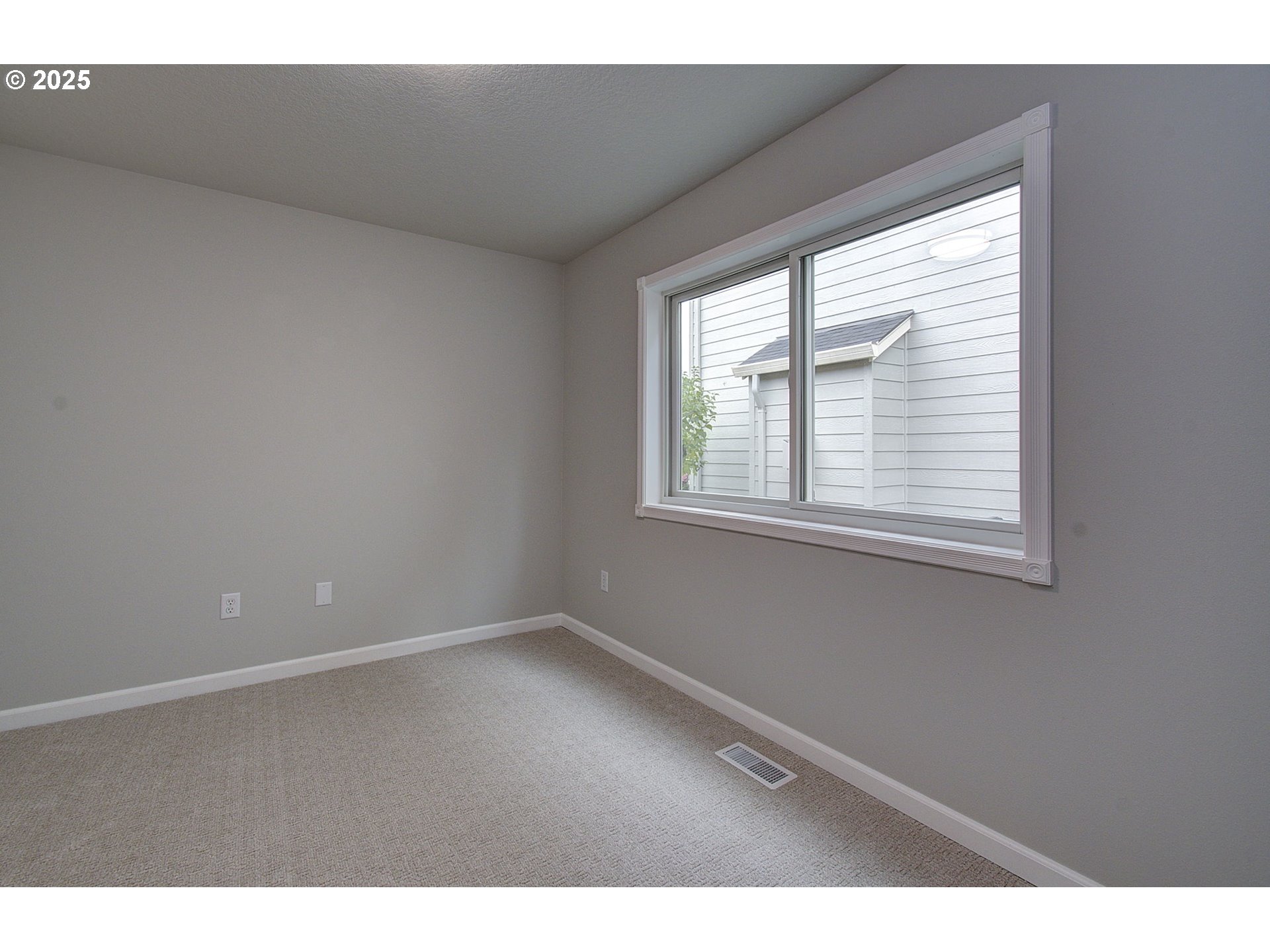 2513 Northwest 147th Street Vancouver, WA 98685 - Photo 22 of 42 a view of an empty room with a window
