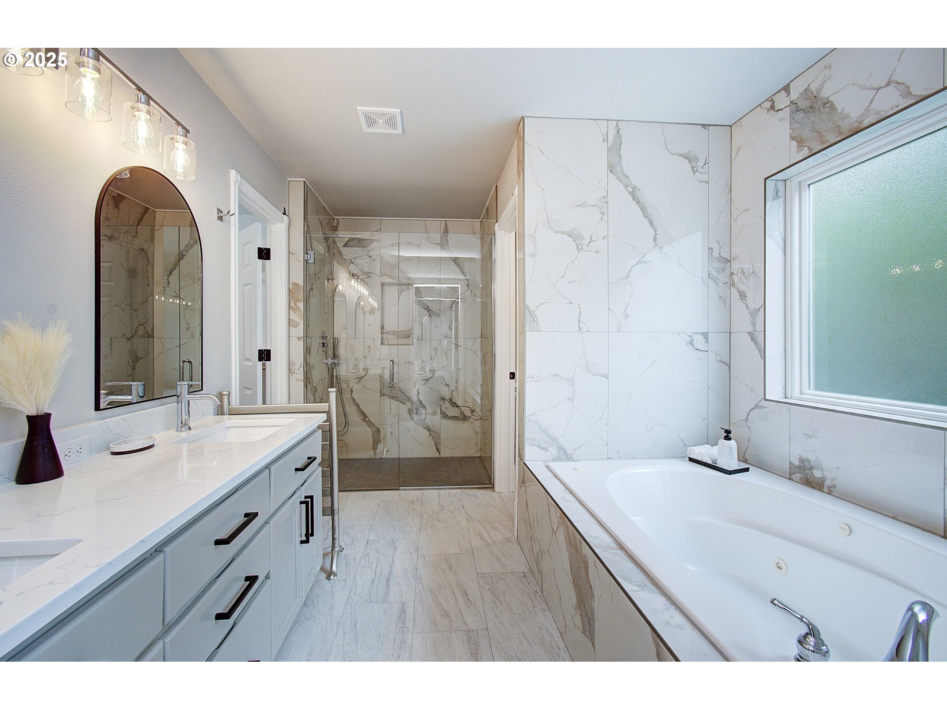 2513 Northwest 147th Street Vancouver, WA 98685 - Photo 29 of 42 a bathroom with a double vanity sink mirror and shower