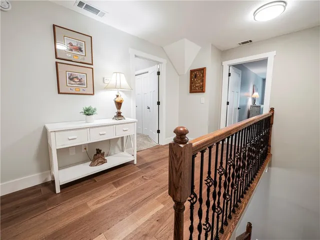 a view of room with furniture and wooden floor