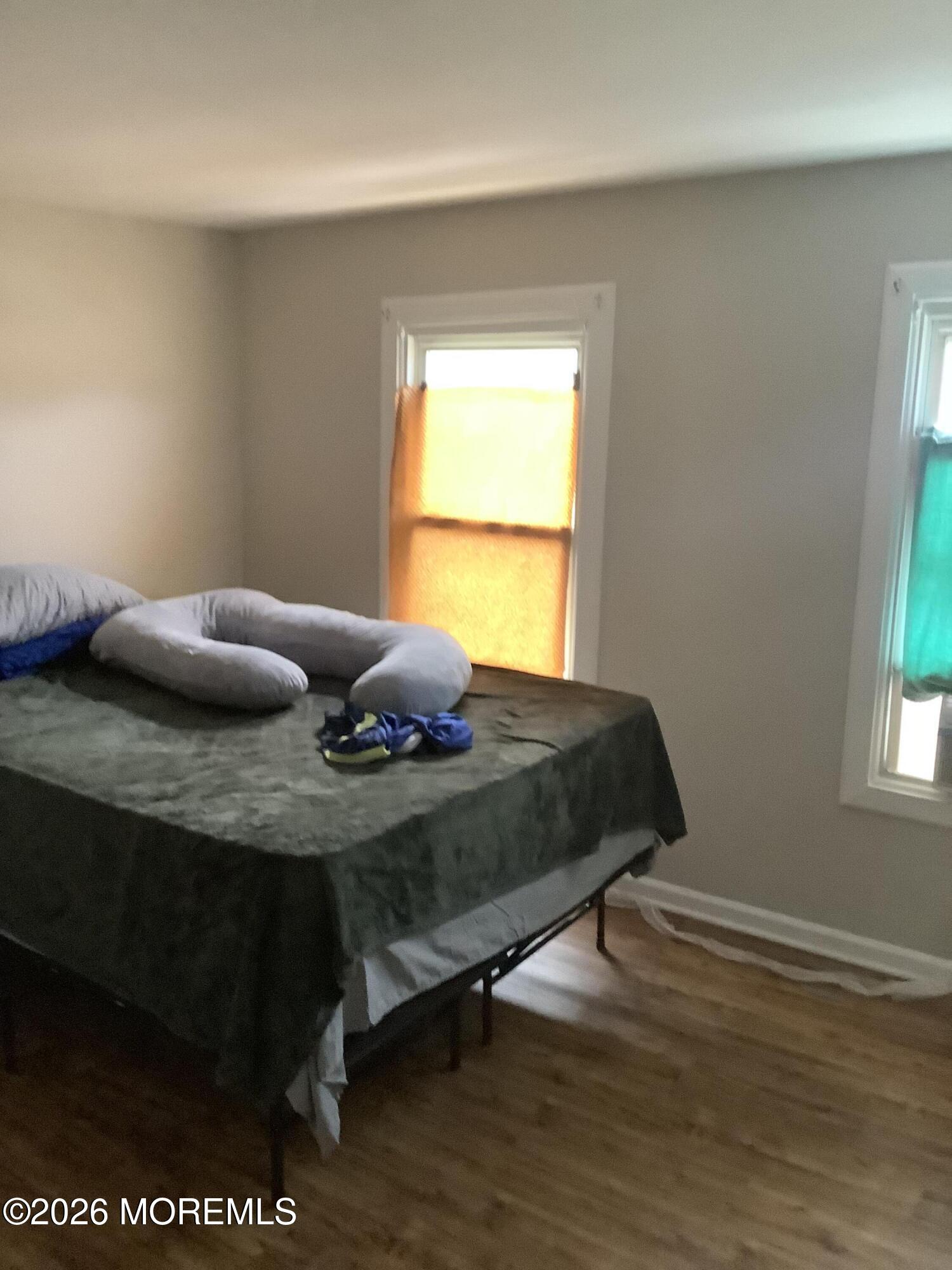 242 1st Street Keyport, NJ 07735 - Photo 16 of 23 a bedroom with a bed and window