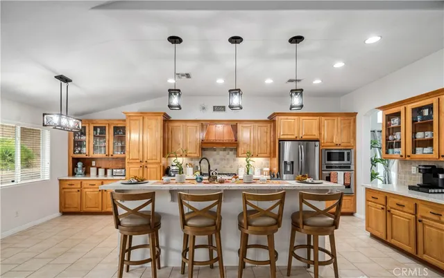 a large kitchen with a table and chairs
