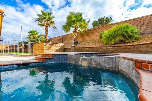 a view of a swimming pool with a yard