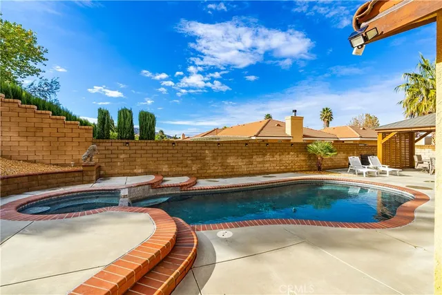 a view of swimming pool with outdoor seating