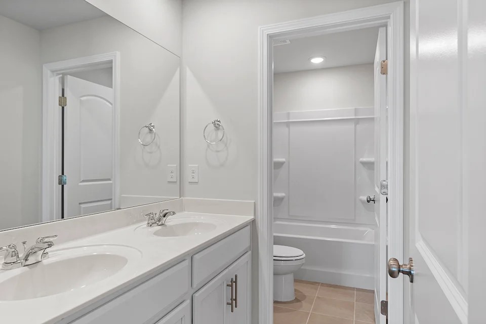 2430 Beverly Gail Road Pleasant View, TN 37146 - Photo 35 of 41 a bathroom with a sink a toilet and shower