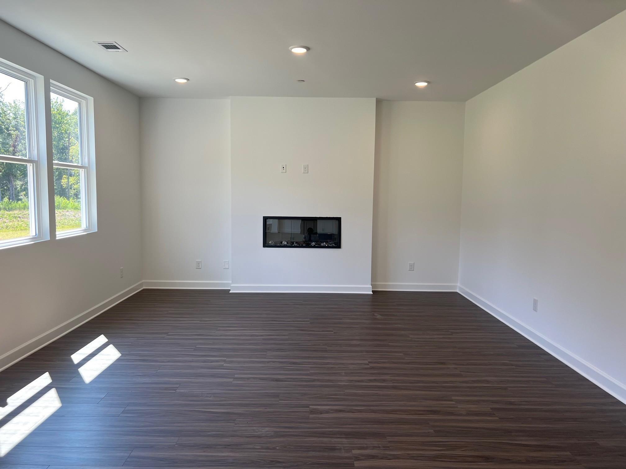 2430 Beverly Gail Road Pleasant View, TN 37146 - Photo 4 of 41 an empty room with wooden floor and windows