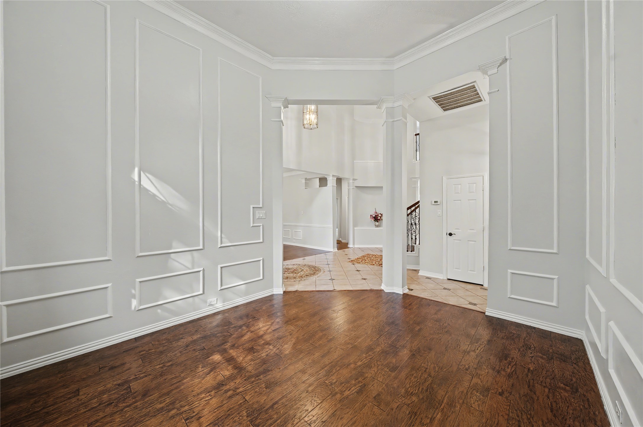 5403 Emerald Pointe Lane Sugar Land, TX 77479 - Photo 11 of 50 a view of an empty room with wooden floor and window