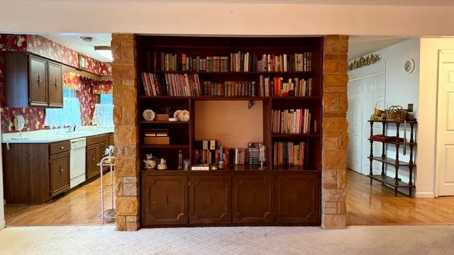 a living room with furniture and a chair