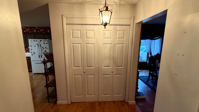 a bathroom with a sink and mirror with toilet