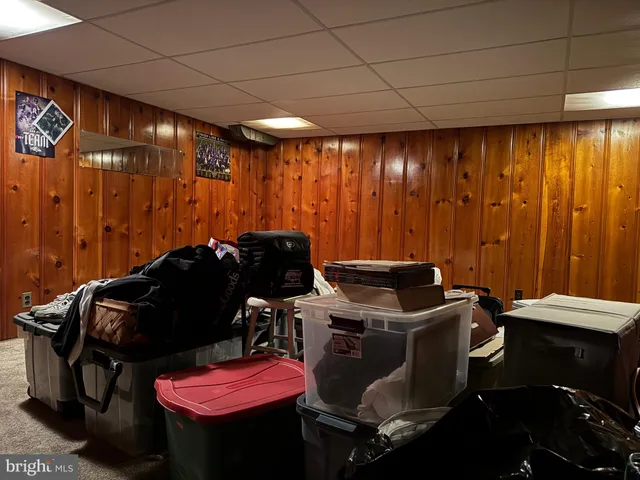 a room with furniture and musical instruments