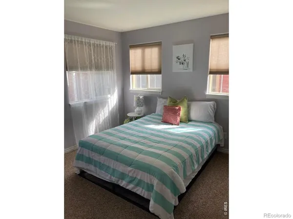 a living room with a flat screen tv and a couch