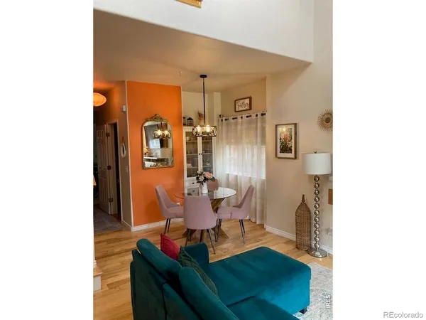 a living room with furniture and stairs