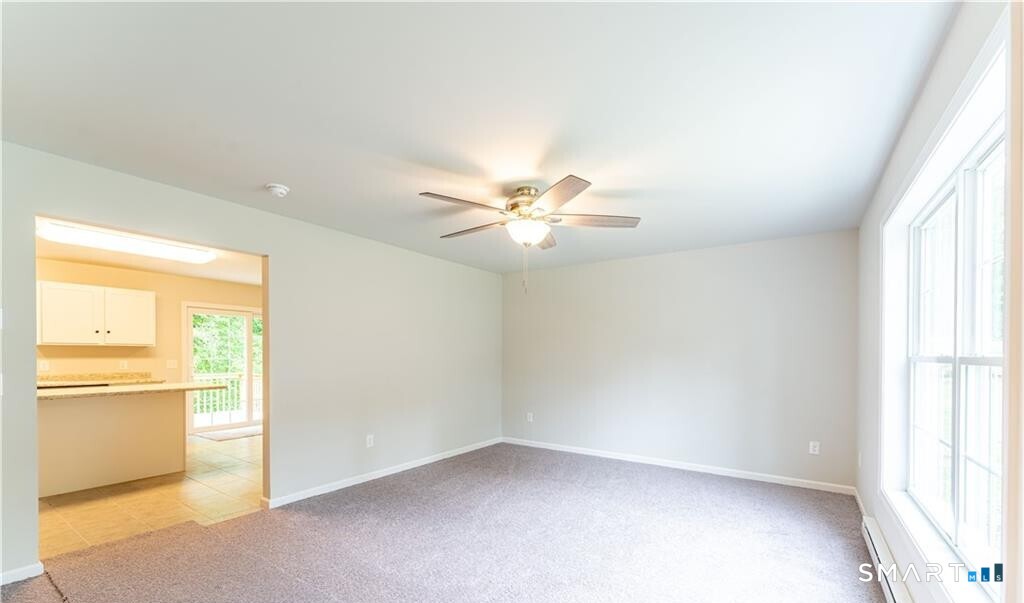 152 Grove Avenue, Unit B Groton, CT 06340 - Photo 12 of 17 a view of an empty room with a window
