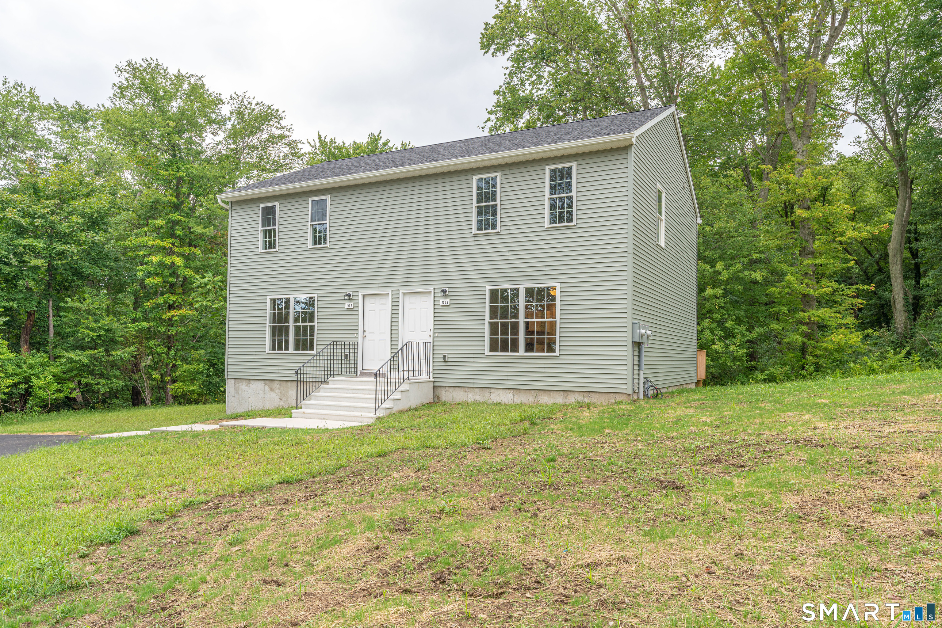 152 Grove Avenue, Unit B Groton, CT 06340 - Photo 2 of 17 a house view with a sitting space and garden