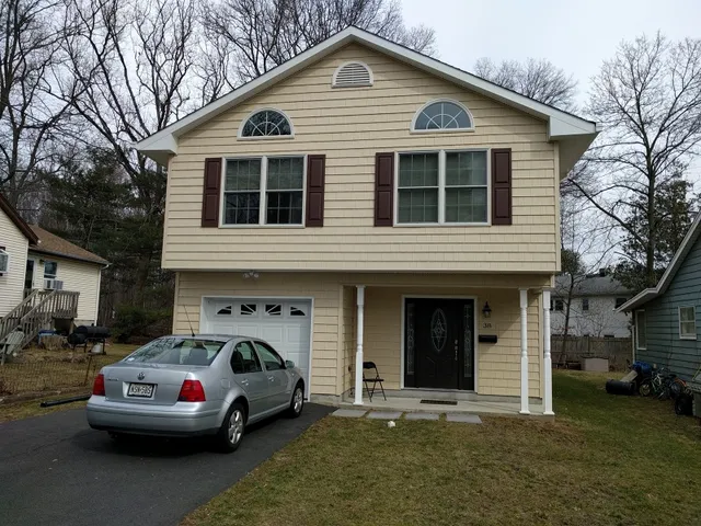 a car parked in front of a house