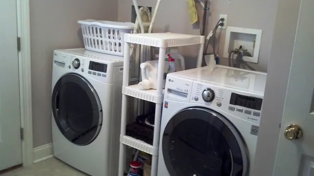 a view of washer and dryer with kitchen in the background