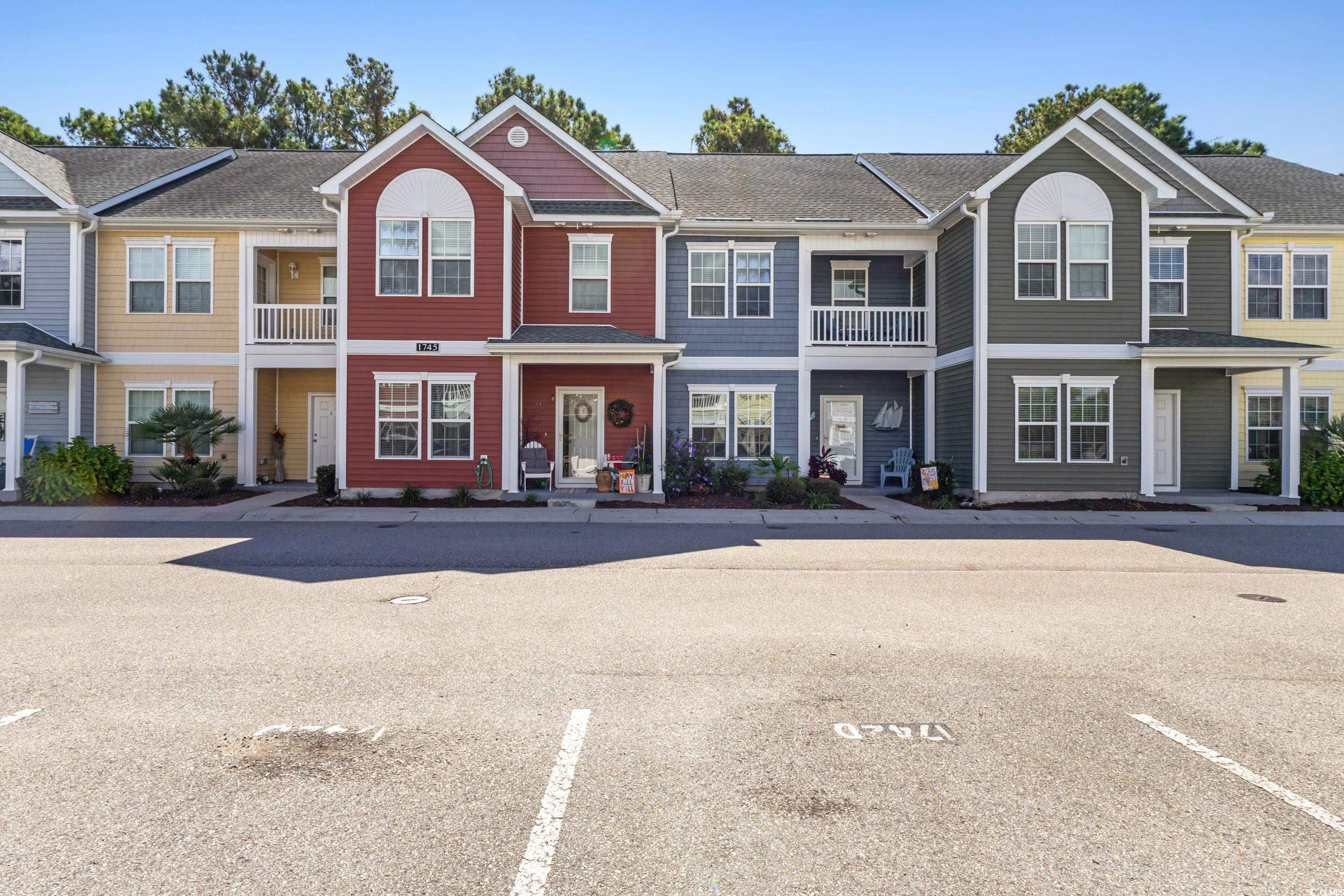 1745 Low Country Place, Unit D Columbia, SC 29209 - Photo 1 of 38 Traditional home with a residential view, uncovered parking, a balcony, and a shingled roof