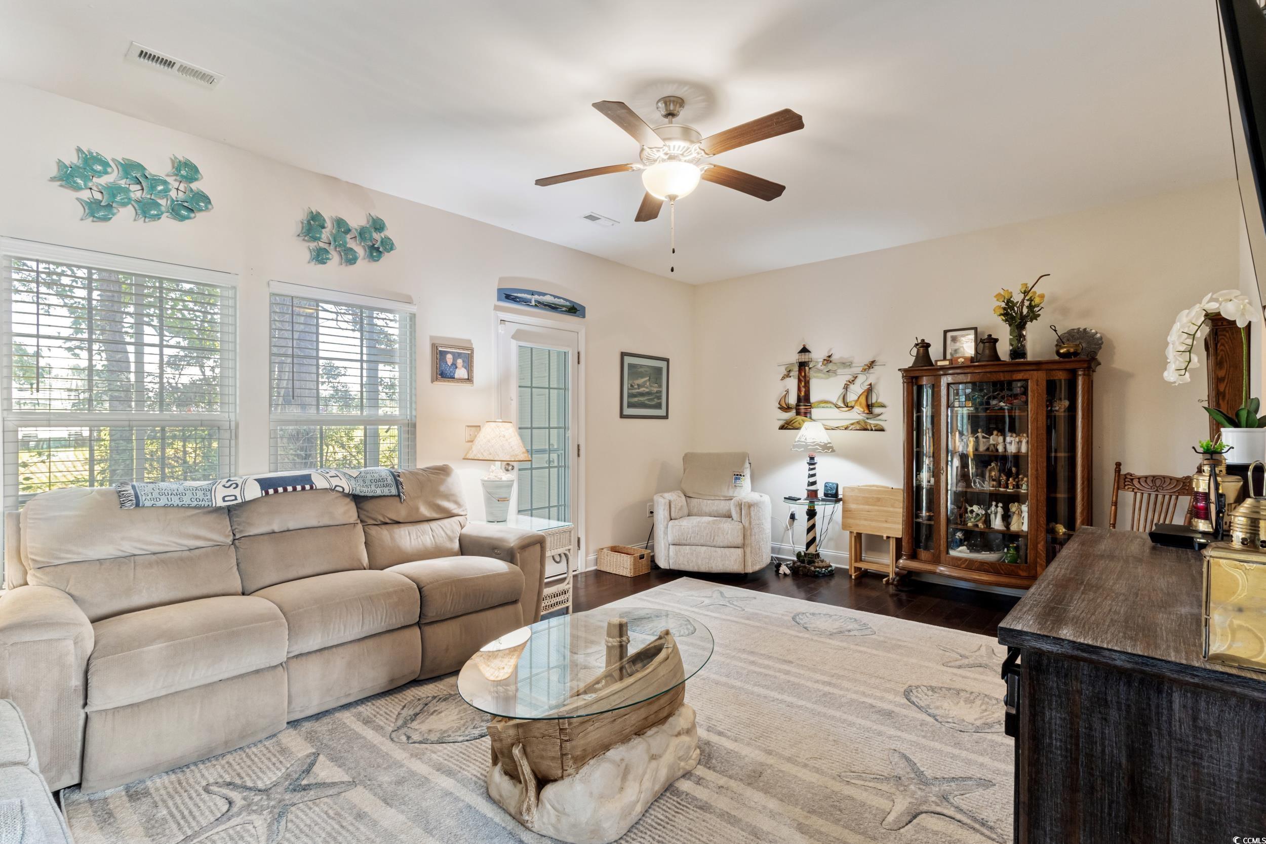 1745 Low Country Place, Unit D Columbia, SC 29209 - Photo 11 of 38 Living area featuring dark wood-style floors and ceiling fan