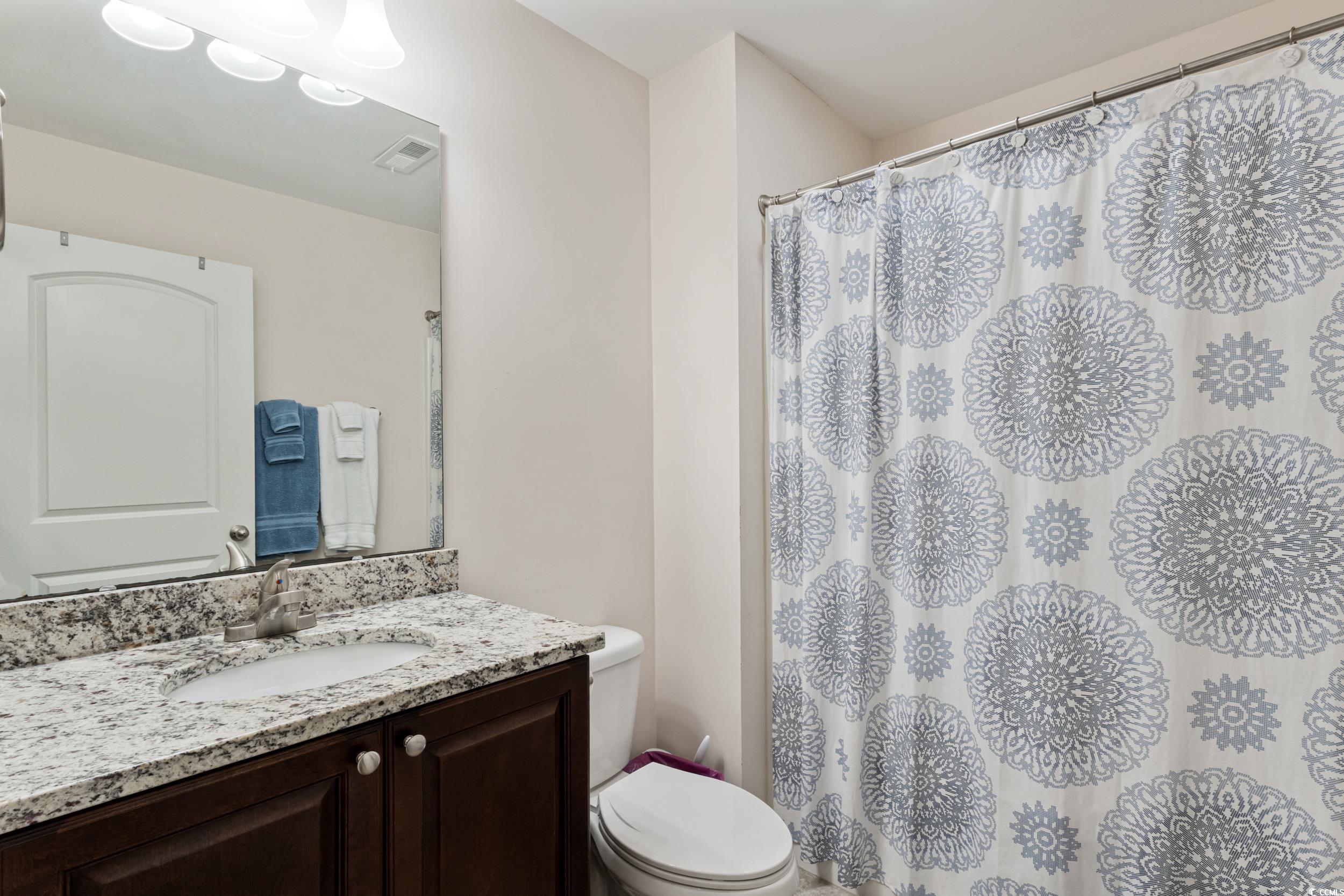 1745 Low Country Place, Unit D Columbia, SC 29209 - Photo 31 of 38 Full bath with vanity, light tile patterned flooring, and a shower with curtain