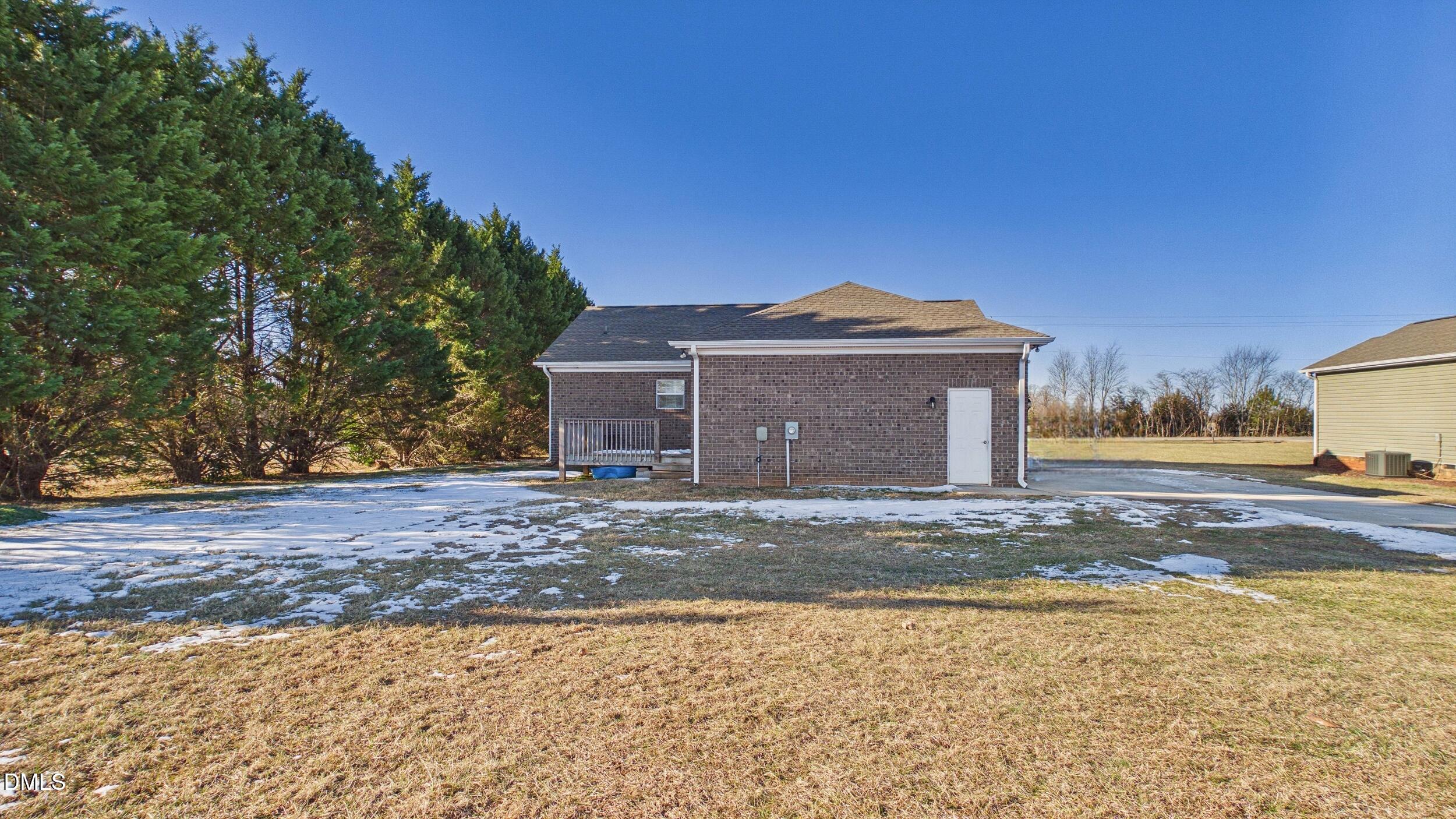 5930 Old 421 Road Liberty, NC 27298 - Photo 34 of 42 a front view of a house with a yard