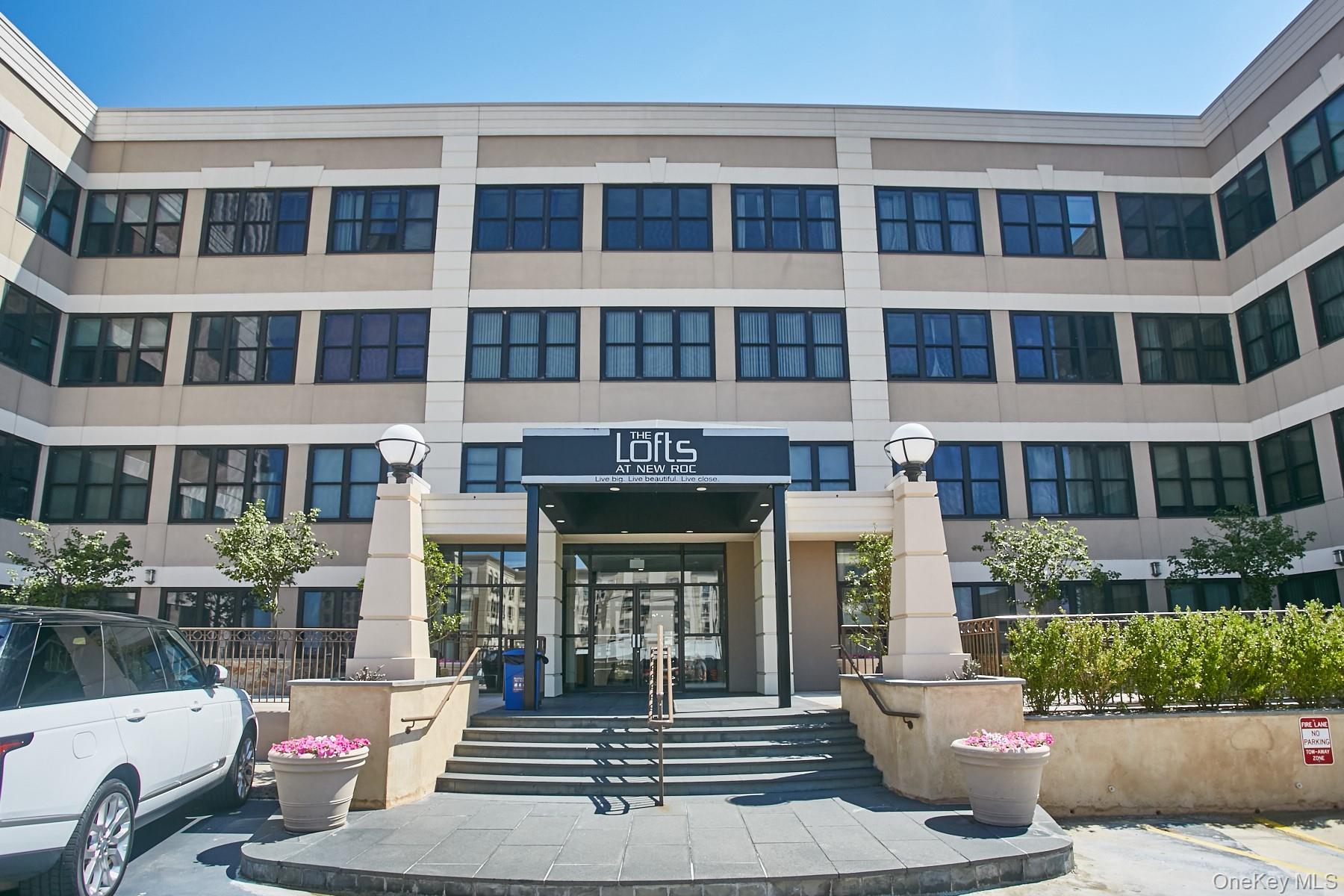 a front view of a building with windows