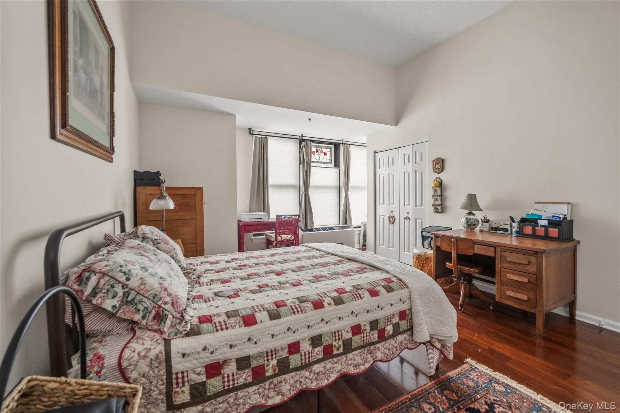 100 New Roc City Plaza, Unit 104 New Rochelle, NY 10801 - Photo 11 of 36 a bedroom with a bed and wooden floor