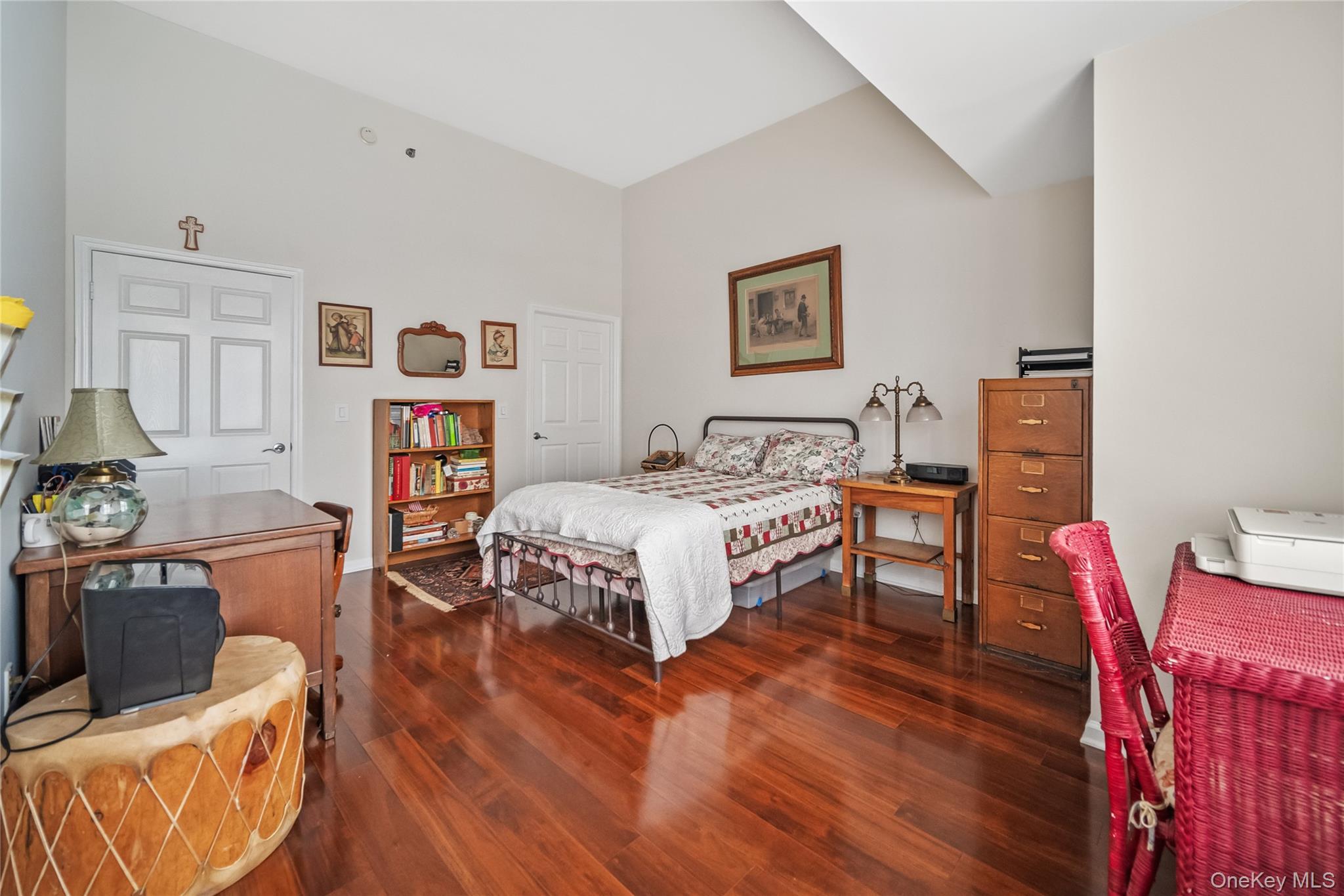 100 New Roc City Plaza, Unit 104 New Rochelle, NY 10801 - Photo 12 of 36 a bedroom with furniture and a wooden floor