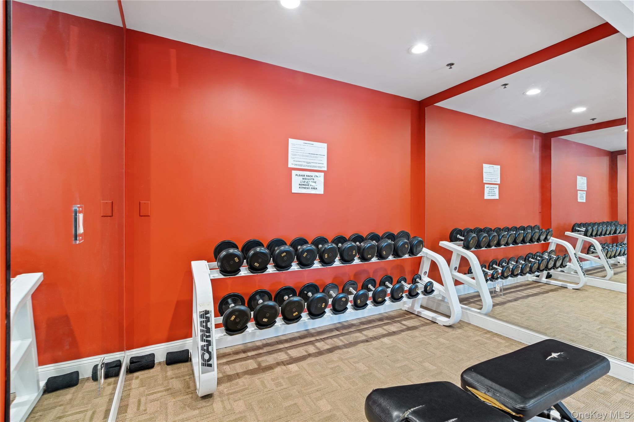 100 New Roc City Plaza, Unit 104 New Rochelle, NY 10801 - Photo 29 of 36 a bed room with a bed and a couch