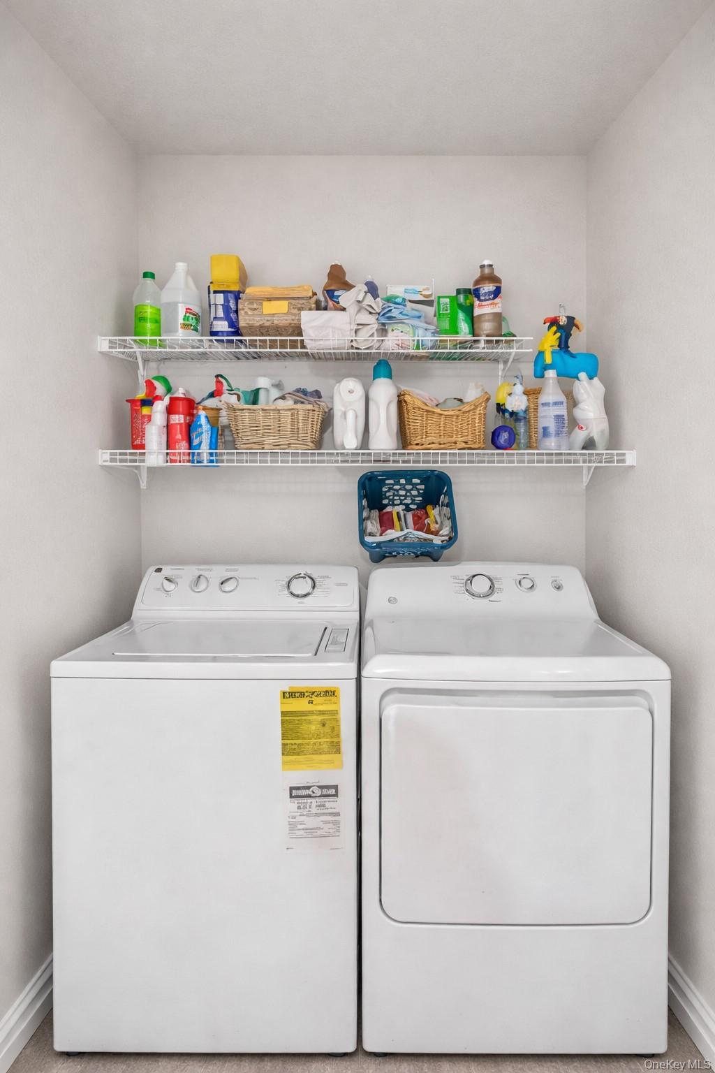 100 New Roc City Plaza, Unit 104 New Rochelle, NY 10801 - Photo 9 of 36 a utility room with dryer and washer